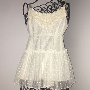 Sheer, slightly off-white top.